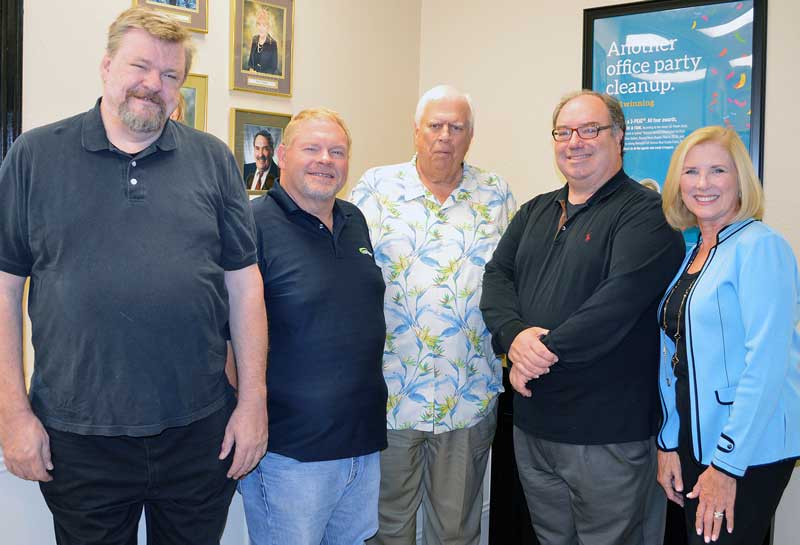 Hill Country Community Theatre Executive Director Mike Rademaekers (left) and theater board President Linda DiFede (right) thank the Martin Foundation, represented by Larson Lloyd, Charlie Keiser, Frank Reilly, and Robert Klaeger (not pictured), for the foundation’s generous donation of $10,000. Courtesy photo