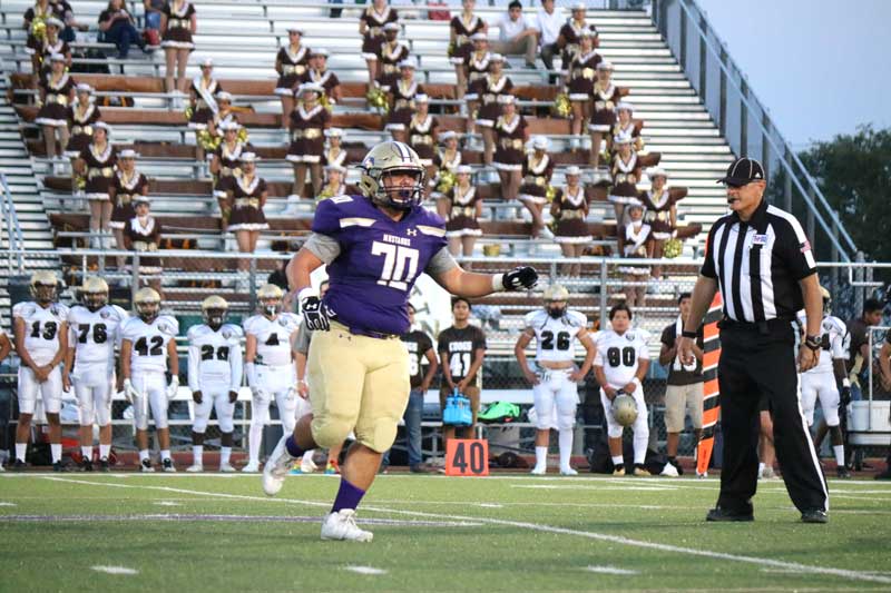 Marble Falls High School senior receiver Keegan Deering catches a 4-yard touchdown pass with 34 seconds left in the first half to give the Mustangs a 10-8 lead against Austin Crockett going into the locker room Sept. 15. Marble Falls won 16-8. Photo by Martelle Luedecke