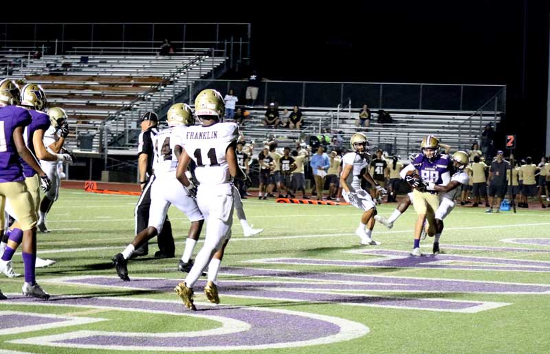 Marble Falls High School senior receiver Keegan Deering catches a 4-yard touchdown pass with 34 seconds left in the first half to give the Mustangs a 10-8 lead against Austin Crockett going into the locker room Sept. 15. Marble Falls won 16-8. Photo by Martelle Luedecke