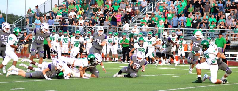 Marble Falls High School junior linebacker Reece Vanhoose recovers a fumble during the first half of the Mustangs’s 27-14 loss to Burnet on Sept. 8. The Mustangs host Austin Crockett on Sept. 15 with a 7:30 p.m. kickoff. Photo by Martelle Luedecke