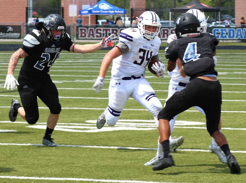 Marble Falls High School junior running back Dillon Mayberry carries the ball against Bastrop Cedar Creek on Sept. 2 during the Mustangs’ 28-14 win to open the season. Photo courtesy of Marble Falls Athletic Booster Club