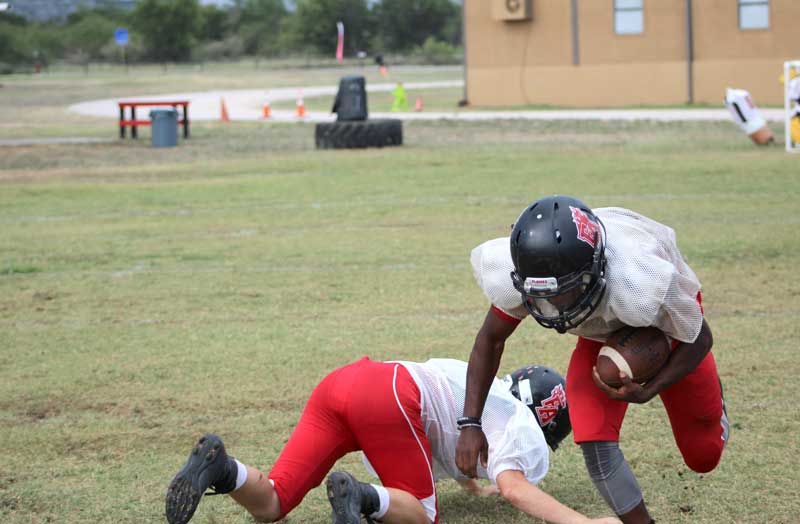 The Faith Academy of Marble Falls football team will rely heavily on sophomore running back Eli Oliver as the Flames begin Division III, District 4 play against Bryan St. Joseph Catholic School. Staff photo by Jennifer Fierro