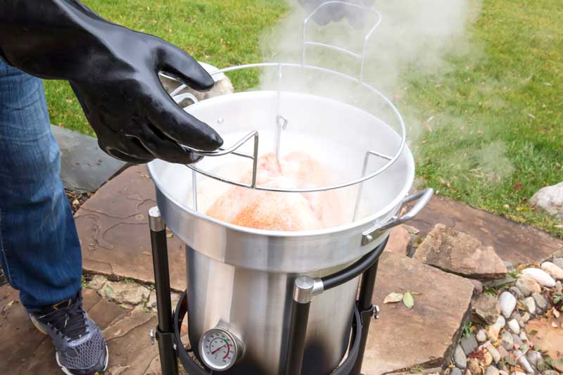 Be sure to protect your hands and eyes from the hot oil while deep-frying turkeys.