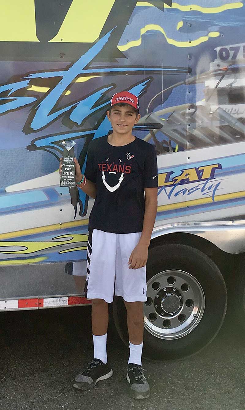 Marble Falls High School freshman Austin Skero poses with his Lucas Oil Drag Boat World Series Finals championship trophy. Courtesy photo