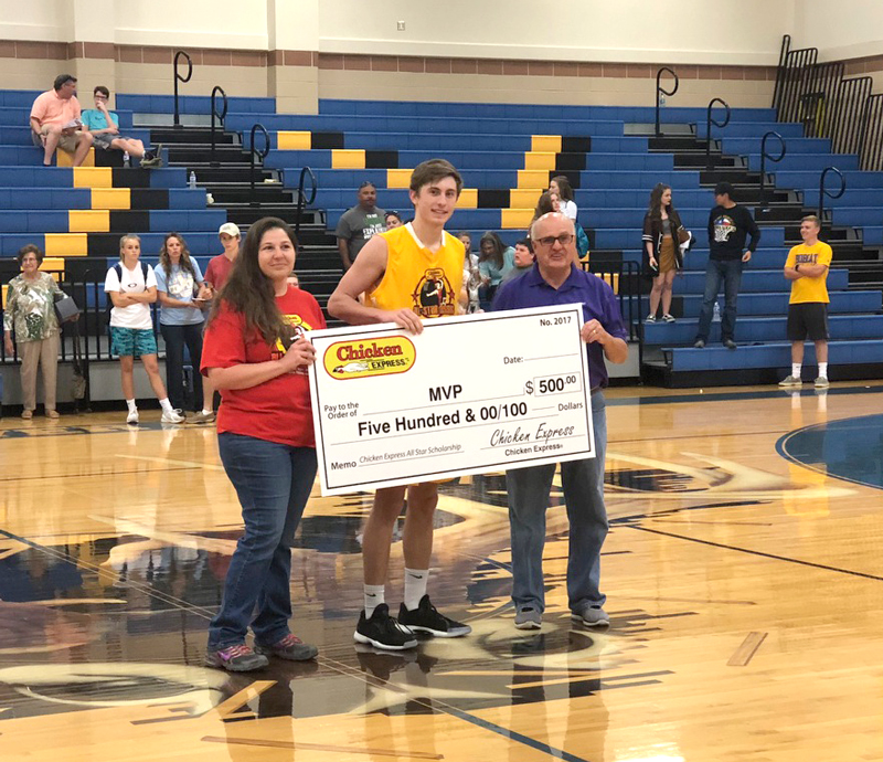 Marble Falls High School senior basketball player Keegan Deering (middle) is presented with a scholarship for $500 after being named the co-Most Valuable Player of the Chicken Express Hill Country All-Star Classic in Kerrville on March 24. Courtesy photo