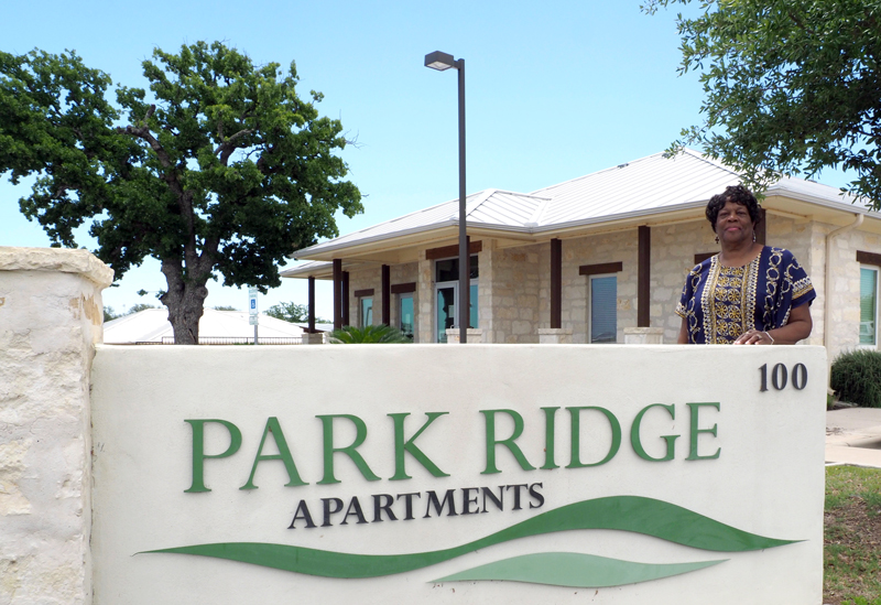 Bessie Jackson of Community Resource Centers of Texas stands in front of Llano County Community Resource Center, 100 Legend Hills Blvd. in Llano. The center provides space for several agencies, including Texas Workforce Commission and nonprofits offering services such as legal assistance to people in need. Highland Lakes Family Crisis Center recently set up an office in the Llano County building to have a better connection with the community. Staff photo by Daniel Clifton