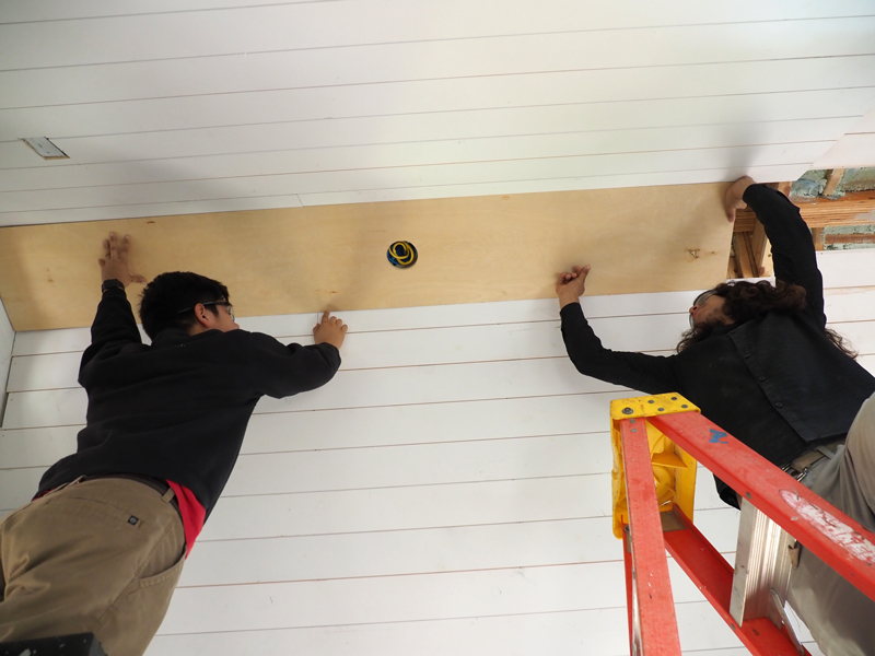 Marble Falls High School seniors Raul Maldonado (left) and Reynaldo Suarez work on a tiny house that the upper-level building trades class started in December 2016 as a project. The house is 100 percent student-built. Marble Falls Independent School District plans to auction off the structure once it’s completed with a tentative date set for June 1. Follow the MFISD Career and Technology Department’s Twitter @MFISDCTE for updates and auction information. Staff photo by Daniel Clifton