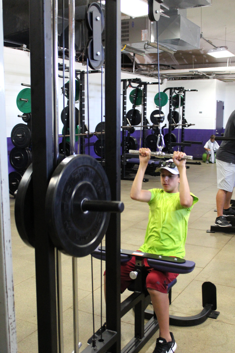 Marble Falls seventh-grader Cameron Graham works out on the lat-pulldown machine at the new weight room at Marble Falls High School. This facility augments the Mustang weight room, which was getting overcrowded during peak times. Staff photo by Jennifer Fierro