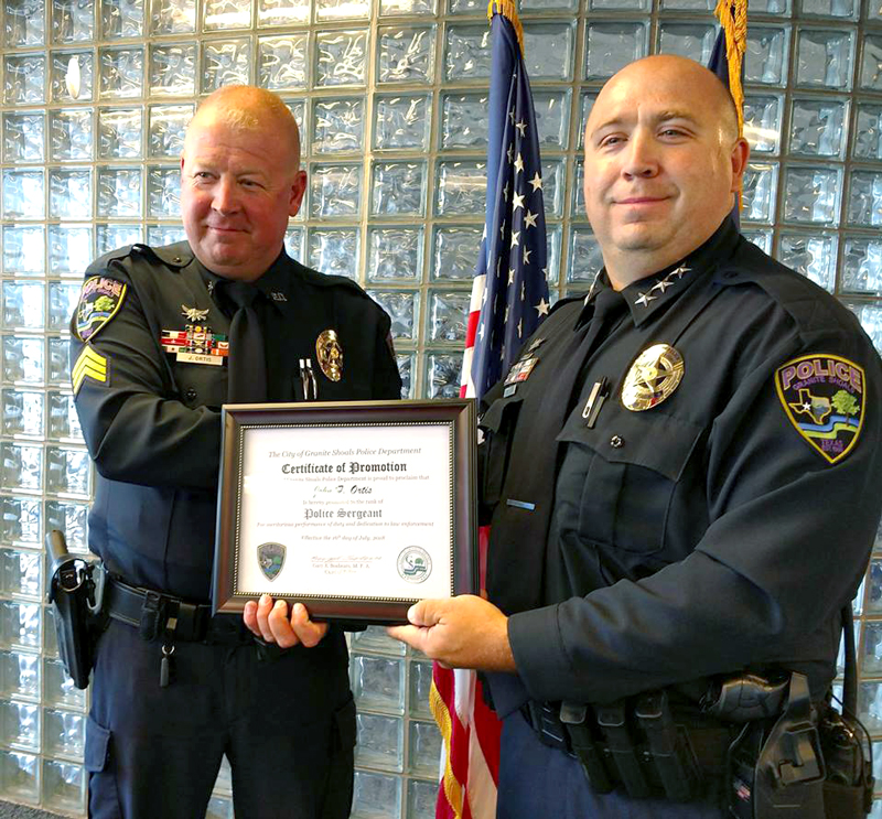 Granite Shoals Police Chief Gary Boshears (right) congratulates the newly promoted Sgt. John Ortis for his advancement. Ortis joined the Granite Shoals Police Department as an officer in 2011. On July 24, Ortis became the department’s latest sergeant. Courtesy photo