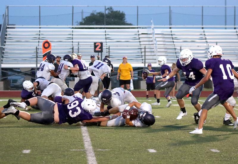 The Marble Falls defense didn’t allow Liberty Hill to gain a first down on this run play during the scrimmage between the two teams Aug. 24. Photo by Martelle Luedecke/Luedecke Photography