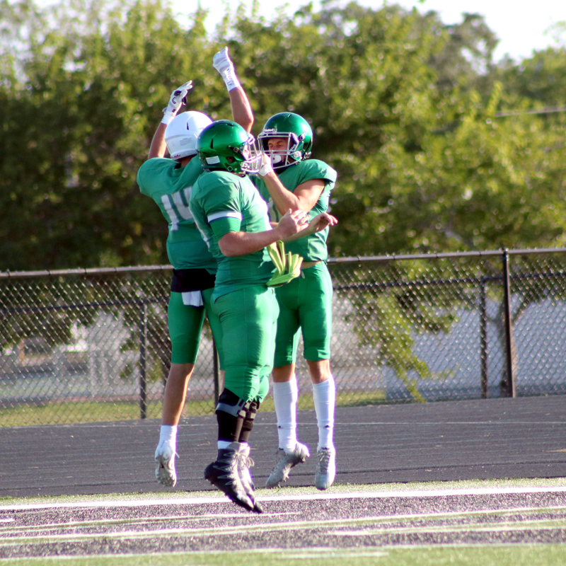 Burnet players celebrated a touchdown in a scrimmage against Austin Crockett on Aug. 17 by junior receiver Blaine Burkhalter. Photo by Martelle Luedecke/Luedecke Photography