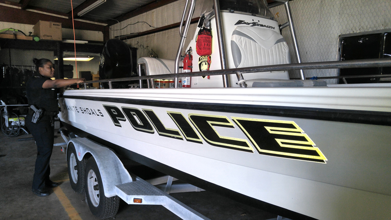 Granite Shoals police officer Christie Carter can already envision the department's boat filled with school supplies for students and teachers. Carter came up with Fill the Boat!, an event that lets people drop off school supplies — to fill the boat — from 7 a.m.-6 p.m. Wednesday, Aug. 15, at the station, 410 N. Phillips Ranch Road. Staff photo by Jennifer Fierro
