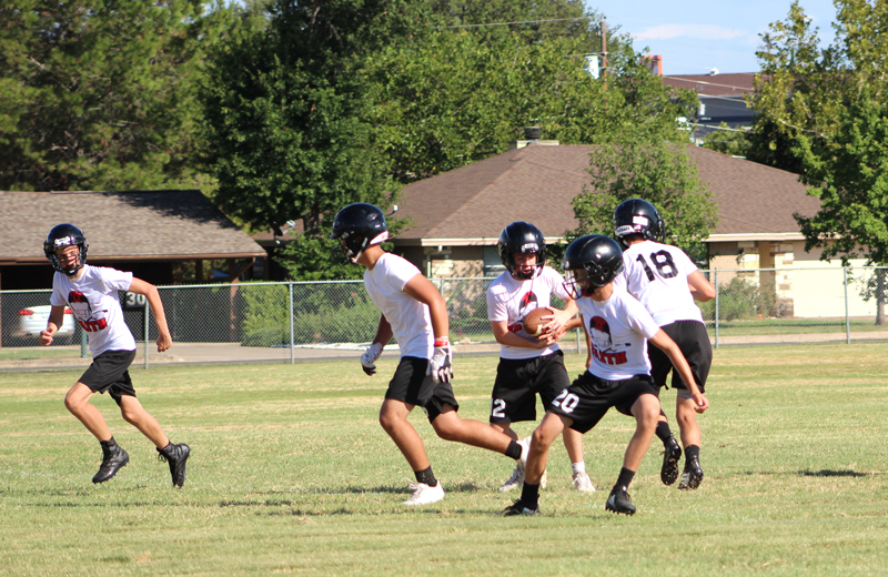 Faith Academy of Marble Falls freshman Connor Turrentine takes the handoff and looks for an open seam during an afternoon practice Aug. 6. Staff photo by Jennifer Fierro