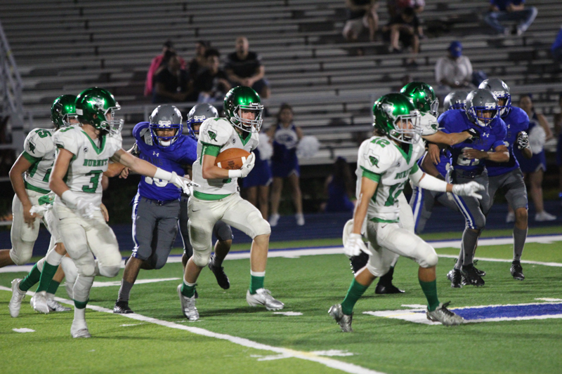 Burnet sophomore receiver Luke Kiser followed a block of sophomore quarterback Jaxson Denton during the 46-0 win over Manor New Tech on Sept. 21. The Bulldogs play a homecoming match against Sonora on Sept. 28 at Bulldog Field. Photo by Martelle Luedecke/Luedecke Photography