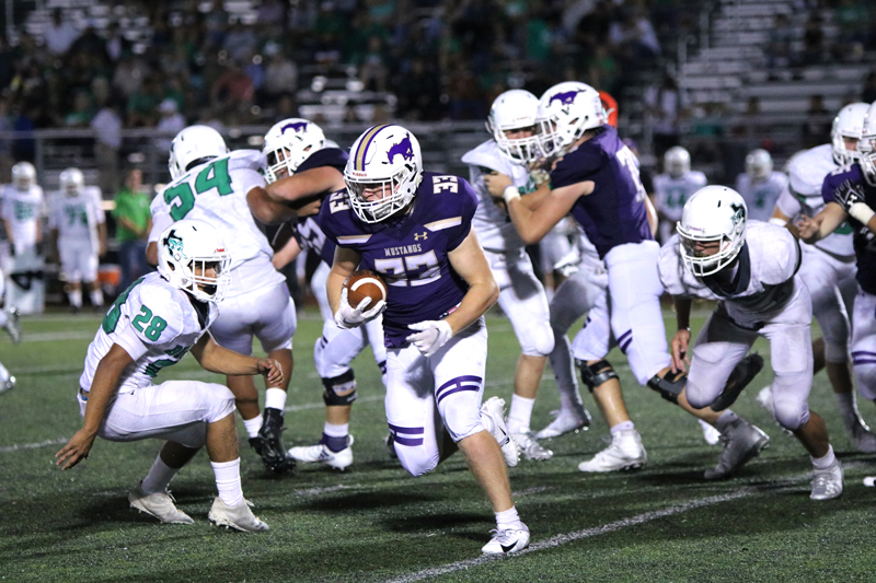 Marble Falls senior running back Cooper Wilson runs for some of his 133 yards against Burnet on Sept. 7. The Mustangs are on the road against Geronimo Navarro on Sept. 14. Photo by Martelle Luedecke/Luedecke Photography