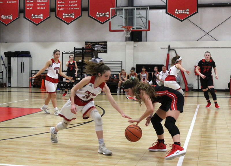 Faith Academy of Marble Falls’s Juliette McCannon looks for a steal during the Lady Flames’ 54-42 loss to Tomball Rosehill Christian on Feb. 16. Staff photo by Jennifer Fierro