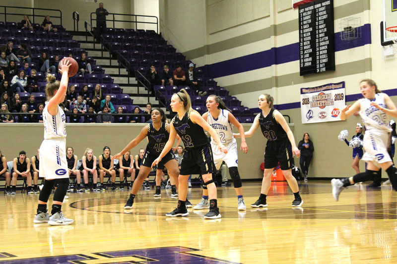 Marble Falls High School senior power forward Trinity Boyd (left), junior point guard Rylie Ulbricht, and senior post Emma Holcomb cover driving lanes to the basket during the 52-37 bi-district loss to Georgetown on Feb. 11. Staff photo by Jennifer Fierro