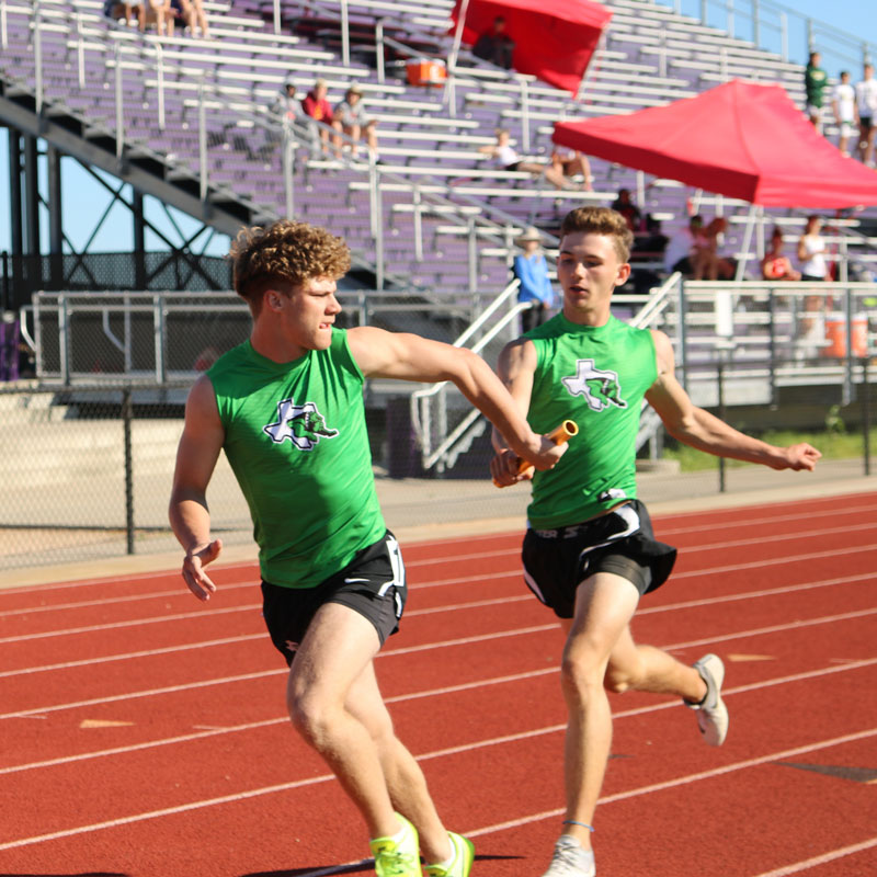 Burnet’s Jaxson Denton (left) and Cameron Guenter-Long finished sixth in the 4x200-meter relay in 1:33.16 at the District 27 and 28 area track meet April 15 at Liberty Hill High School. Photo by Martelle Luedecke/Luedecke Photography