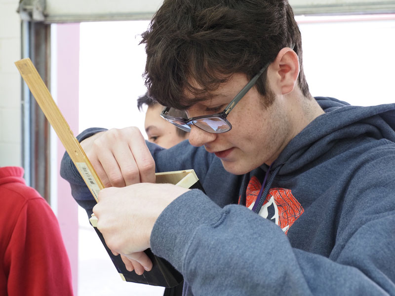 Marble Falls High School engineering students building concrete canoes
