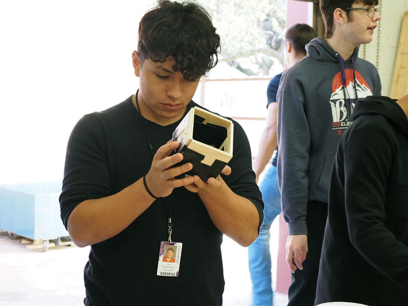 Marble Falls High School engineering students building concrete canoes