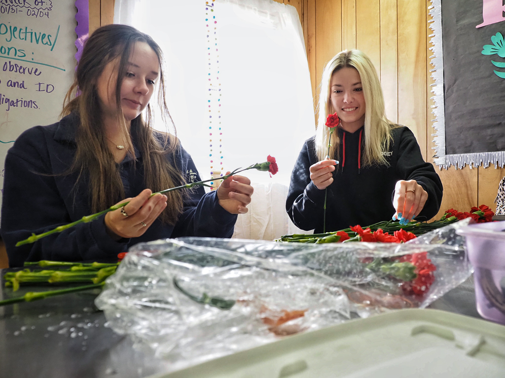 Marble Falls High School floral design students Addison Powell (left) and Ashlyn Walker