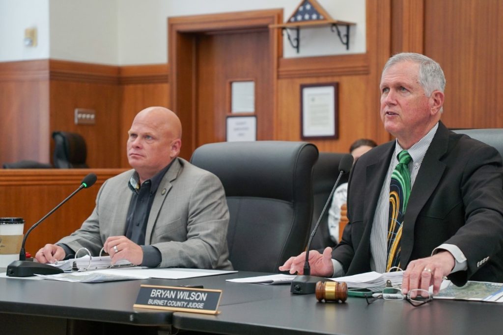county officials sitting at table