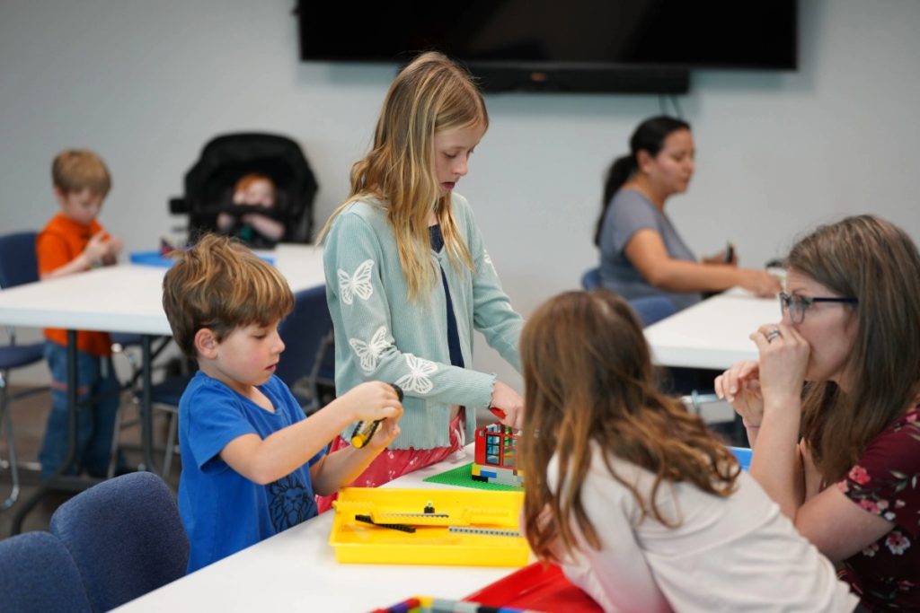 children building with Legos