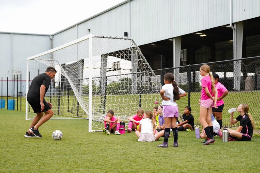 Coach showing a soccer drill