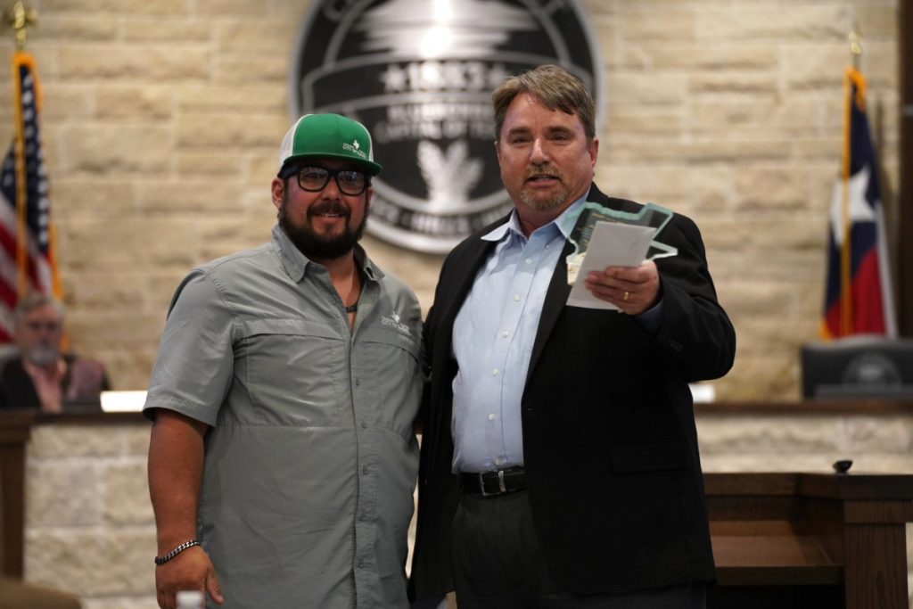 Burnet city equipment operator Matt Feild (left) being presented with the Employee of the Year award on May 12 by City Manager David Vaughn.