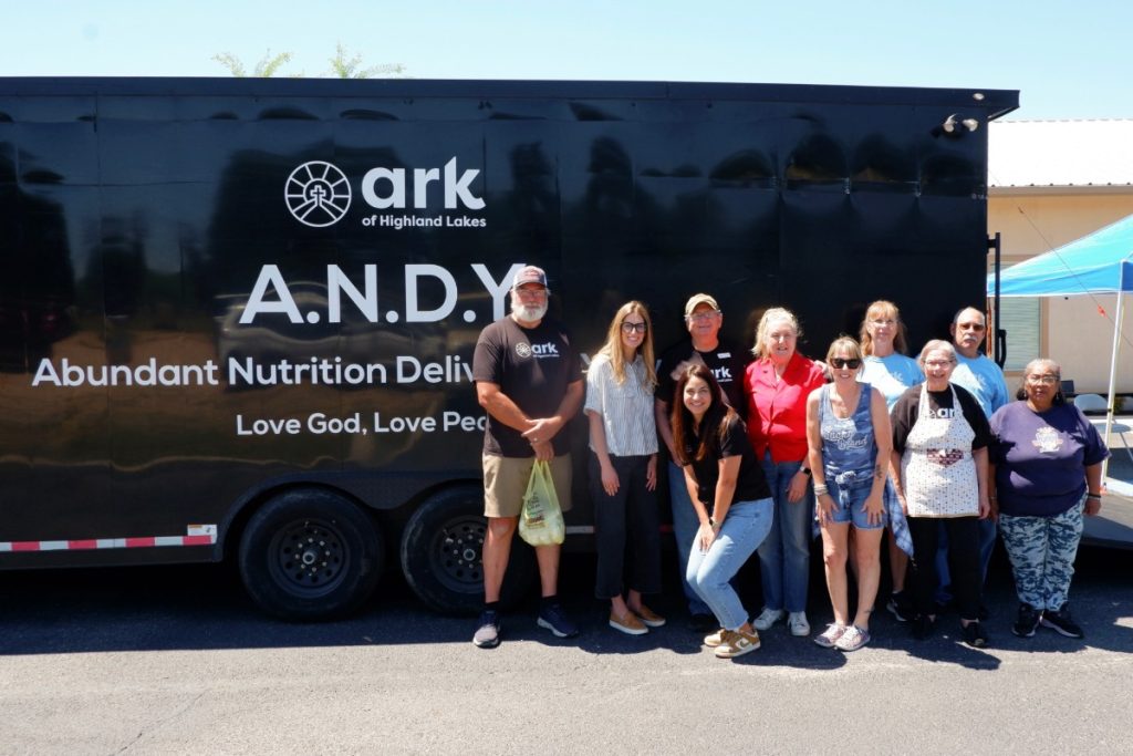 volunteers in front of the A.N.D.Y. trailer
