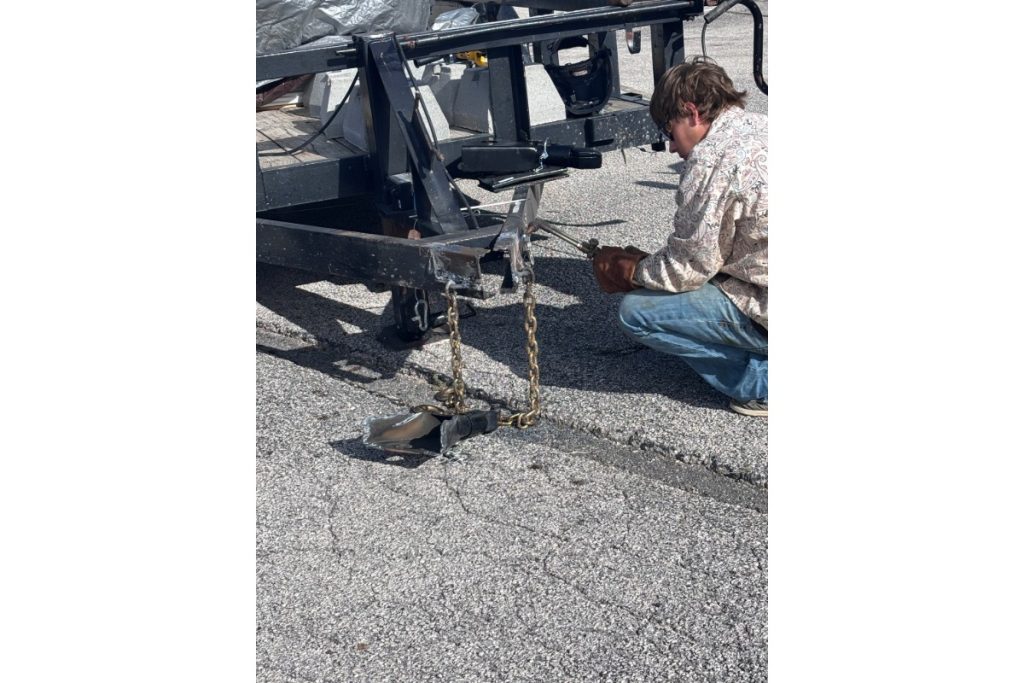 MPACT volunteer hitching a trailer